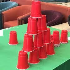 Red solo cups stacked in a pyramid shape. 