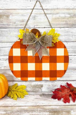 Wooden Pumpkin painted with a ribbon and faux leaves