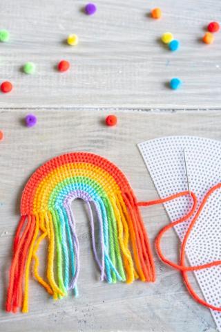 Plastic Canvas Rainbow with pom-poms