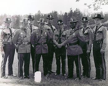 A black-and-white photo from the 1930s of 8 police officers posing together