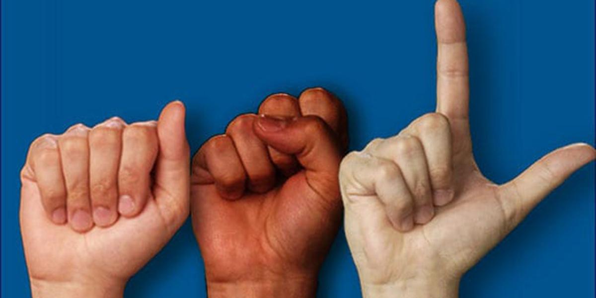 Three hands on a blue background spelling out A S L in the manual alphabet