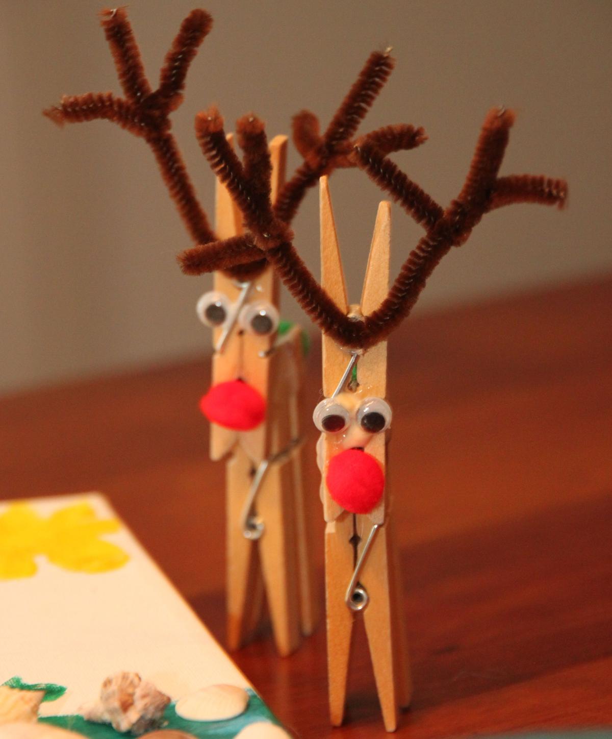 Reindeer made of multiple clothespins, googly eyes and pipe cleaner antlers